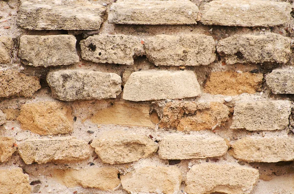 Muro di mattoni molto antico costruito . — Foto Stock