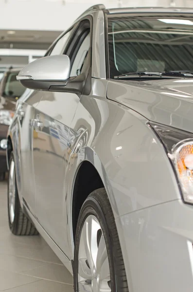 Part of grey car at dealership salon. — Stock Photo, Image