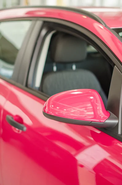 Part of pink car at dealership salon. — Stock Photo, Image