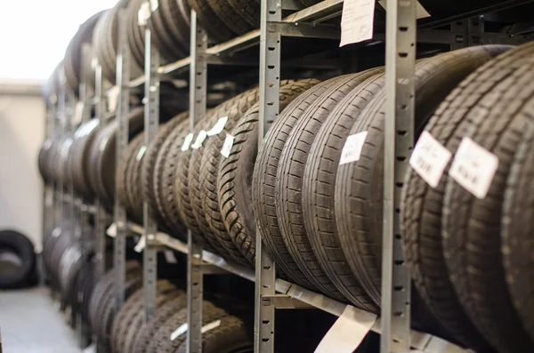 Used old car tires at warehouse. — Stock Photo, Image