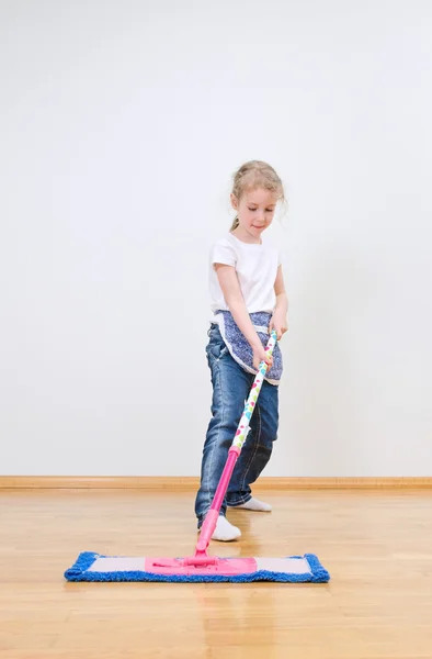 Little cute girl mopping floor at home. — Stock Photo, Image