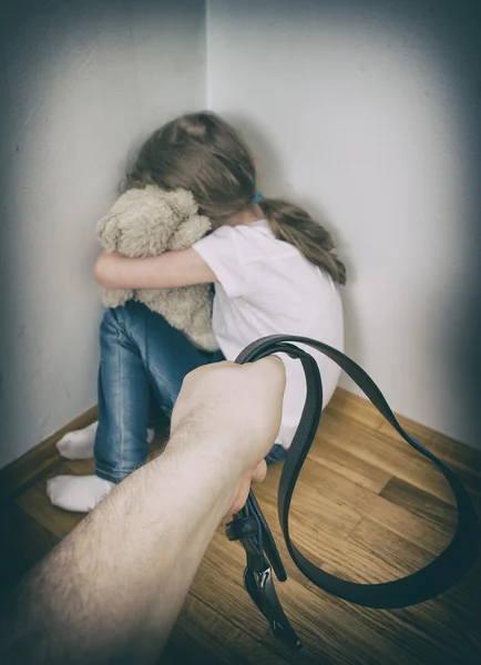 Little girl crying in the corner. Domestic violence concept. — Stock Photo, Image