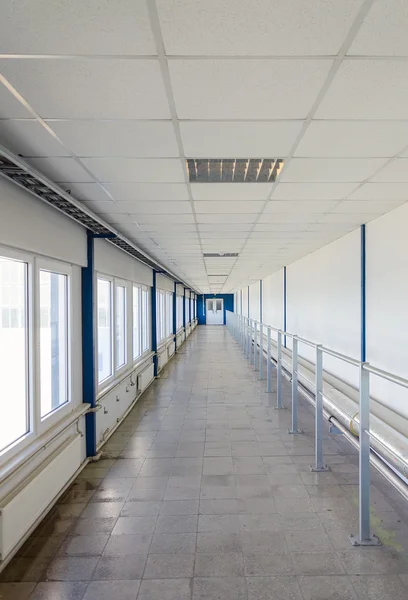 Long corridor with door at end. — Stock Photo, Image