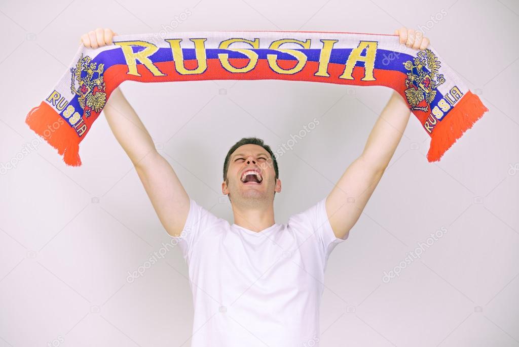 Man supports Russian team with Russian scarf.