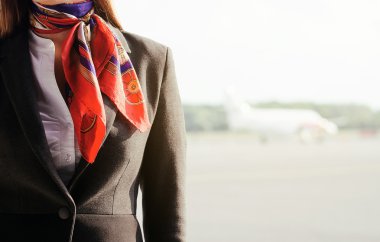 Stewardess on the airfield. Place for your text. clipart