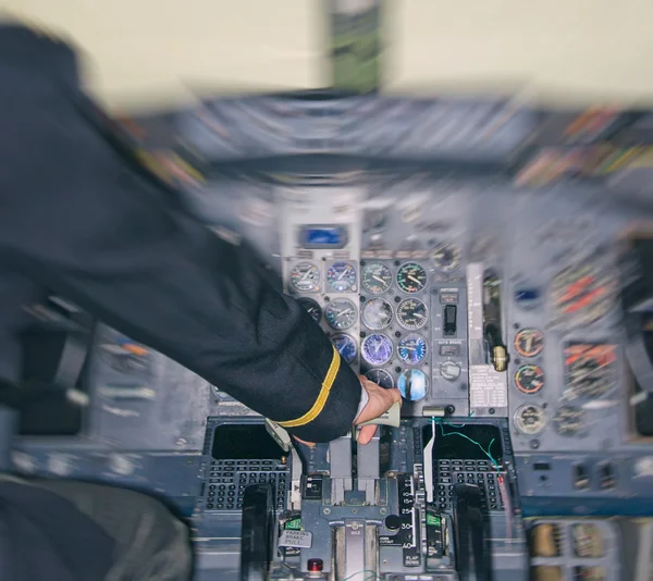 Rear view of pilot in aircraft cabin. Motion effect. — Stock Photo, Image
