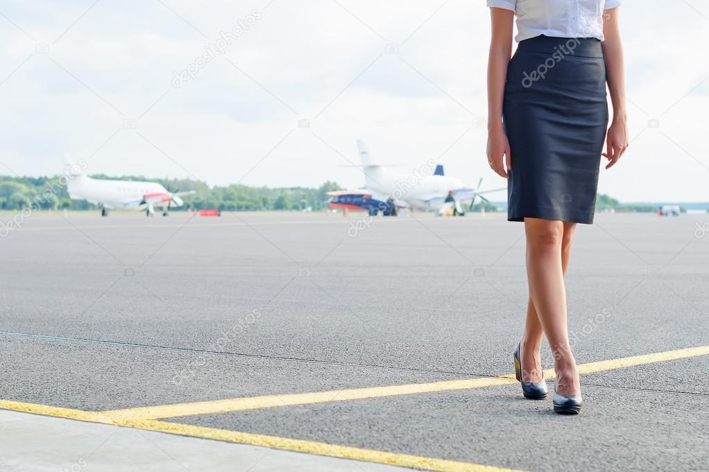 Stewardess on the airfield. Place for your text.