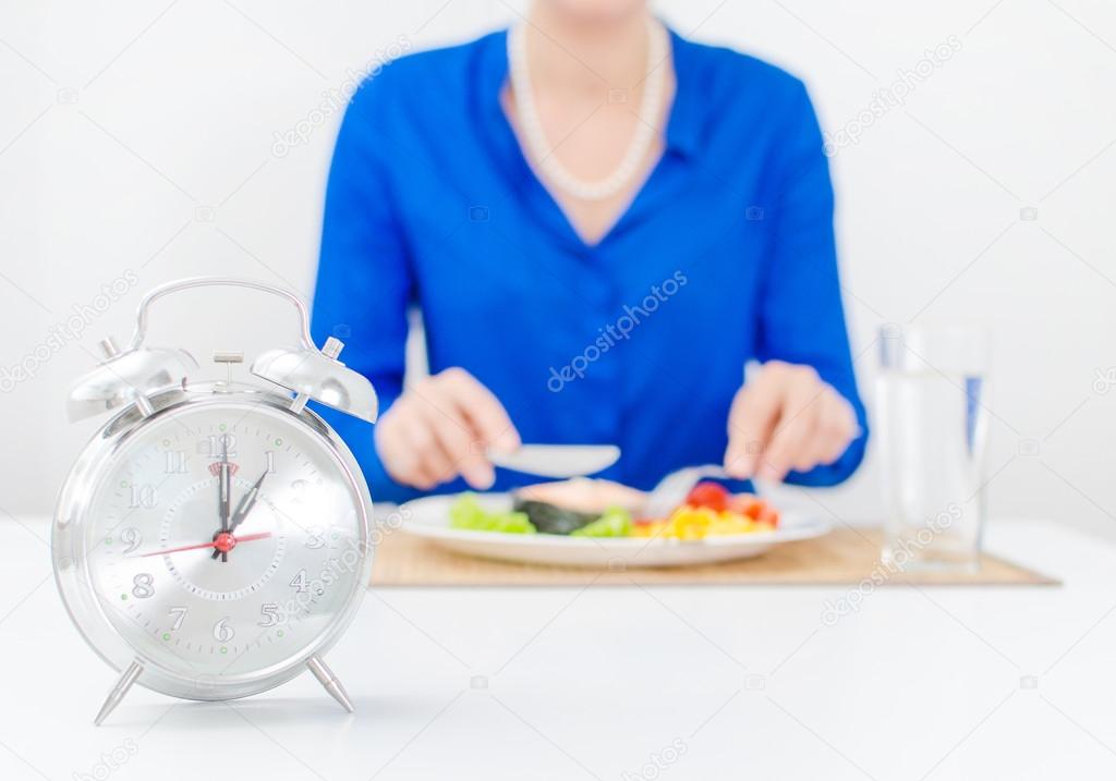 Schedule of the day. Day. Woman having dinner.