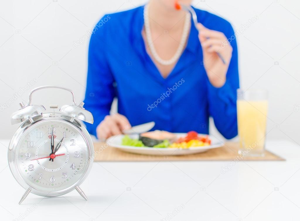 Schedule of the day. Day. Woman having dinner.