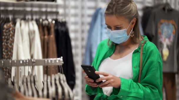 Owner Checks Goods Store Using Her Phone — Stock Video