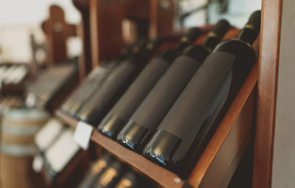 Red Wine Bottles Stacked Wooden Rack — Stock Photo, Image