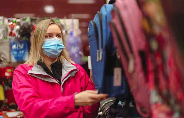 Woman Medical Mask Choosing Kid Backpack School — Stock Photo, Image