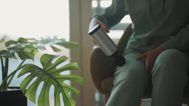 Woman Massaging Leg Massage Percussion Device Home — Stock Video