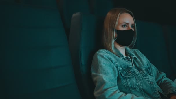 Woman Medical Mask Watching Movie Cinema — Stockvideo