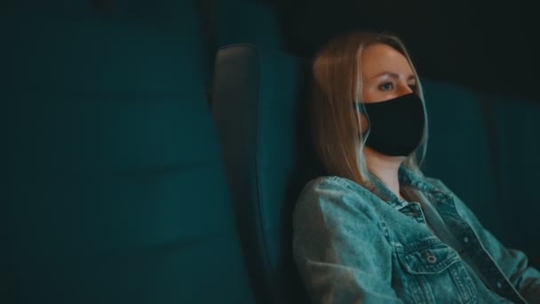 Woman Medical Mask Watching Movie Cinema — Stockvideo