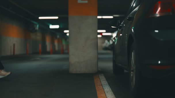 Woman Unlocking Her Car Key Underground Parking — Stock Video