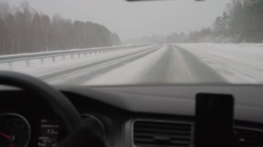 Difficult weather conditions on the road. Snow Plows clear the track.