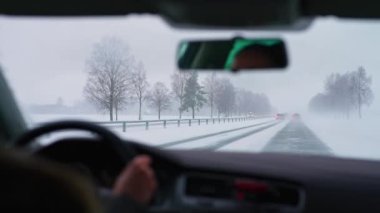 Difficult weather conditions on the road. Snow Plows clear the track.