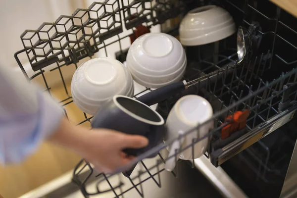 Woman Unloads Dishes Dishwasher — Stock Photo, Image