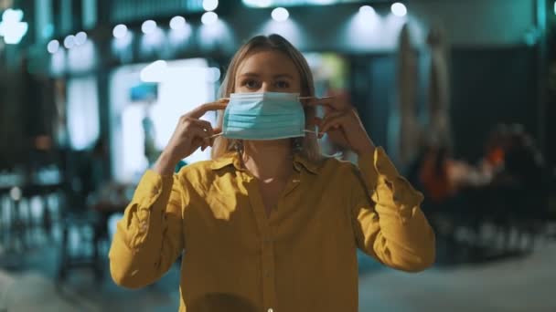 Woman Putting Medical Mask Street Wear Mask Public Place — Stock Video