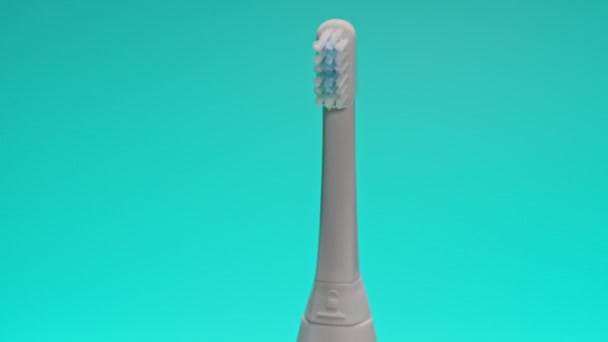 Electric Ultrasonic Toothbrush Shifting Color Background — Stock Video