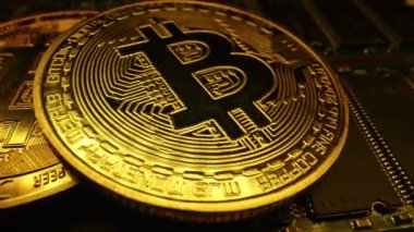Macro view of golden bitcoin with changing color.
