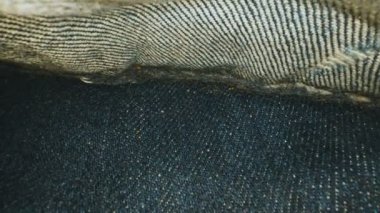The camera comes out of jeans pocket.