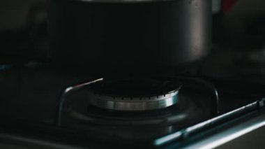 Saucepan on a gas stove. Domestic gas consumption.
