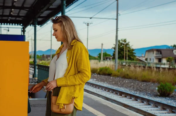 Woman Validates Train Ticket Italy — Photo