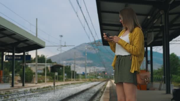 Woman Smartphone Waiting Her Train — Stock Video