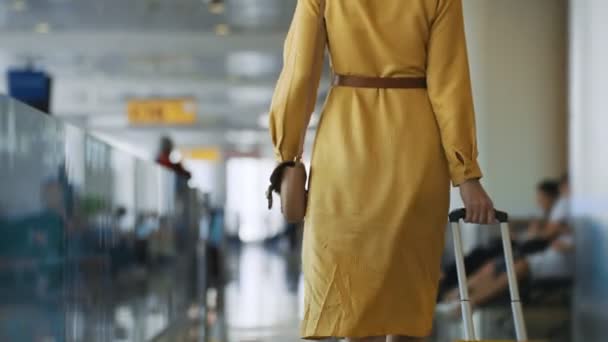 Woman Walking Airport Terminal Back View — ストック動画