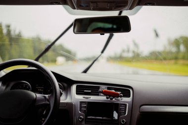 Driving car in bad weather conditions. Heavy rain.