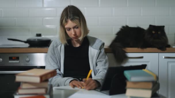 Teenage Girl Doing Her Schoolwork Home — Vídeo de stock