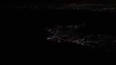 Ischia volcanic island in the Tyrrhenian Sea at night.