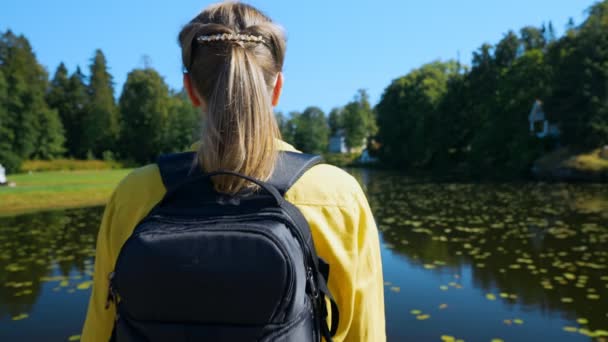 Woman Tourist Backpack Standing Lake — Stockvideo