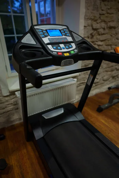 Dashboard of sports treadmill at the home gym.