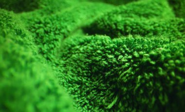 Yeşil yumuşak terry havlu dokusu.