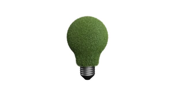 Green grass inside the bulb representing green energy. Rotating 3d object in white background isolated — Stock Video