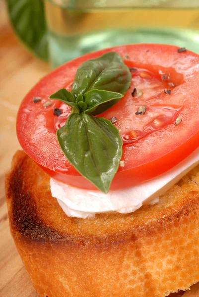 Bruschetta with tomato, mozzarella and basil — Stock Photo, Image