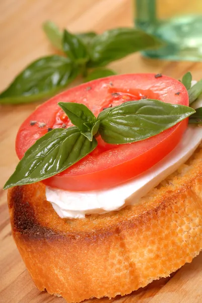 Bruschetta with tomato, mozzarella and basil — Stock Photo, Image