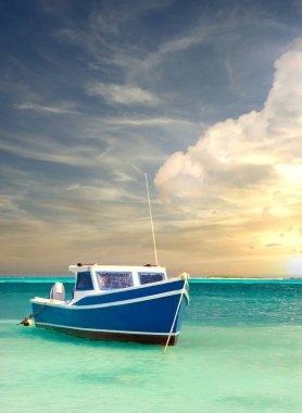 Fisherman's boat in a tranquil bay outside of Oranjestad Aruba under a dramitic sky