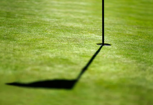 Shadow of a flag on a green — Stock Photo, Image