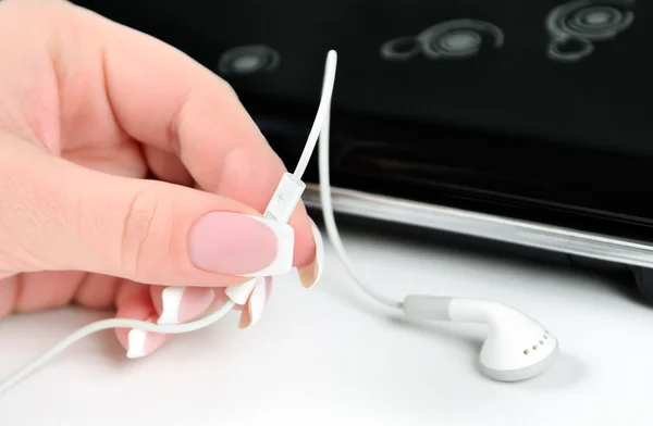 Adjusting headphones volume — Stock Photo, Image