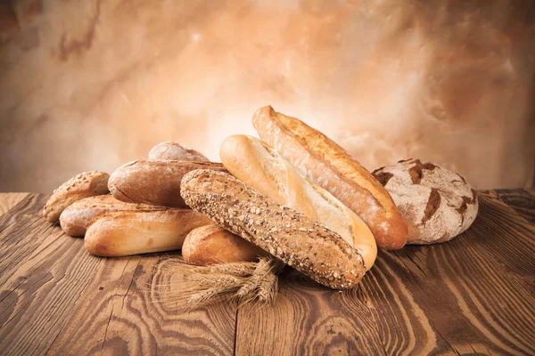 Fresh bread on wood — Stock Photo, Image