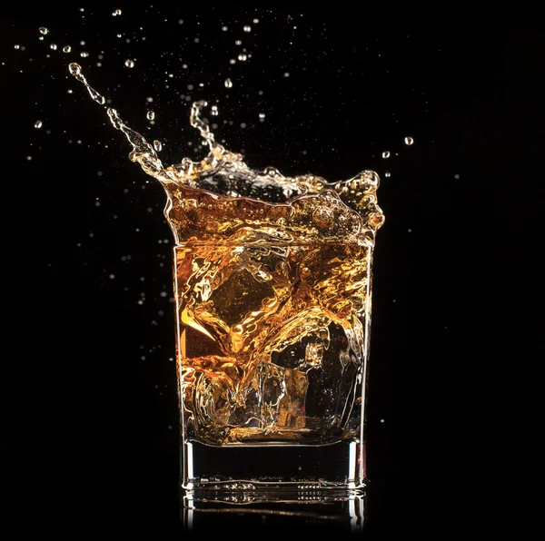 Splashing whiskey — Stock Photo, Image