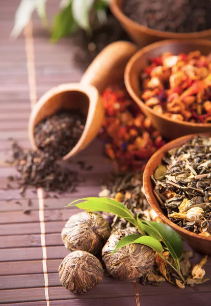 Various dry tea in small bowls — Stock Photo, Image