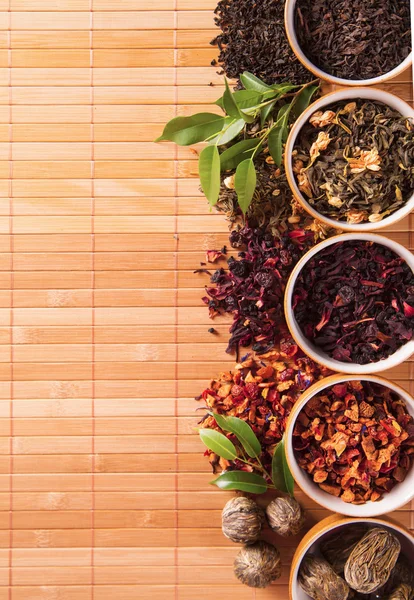 Various dry tea in small bowls — Stock Photo, Image