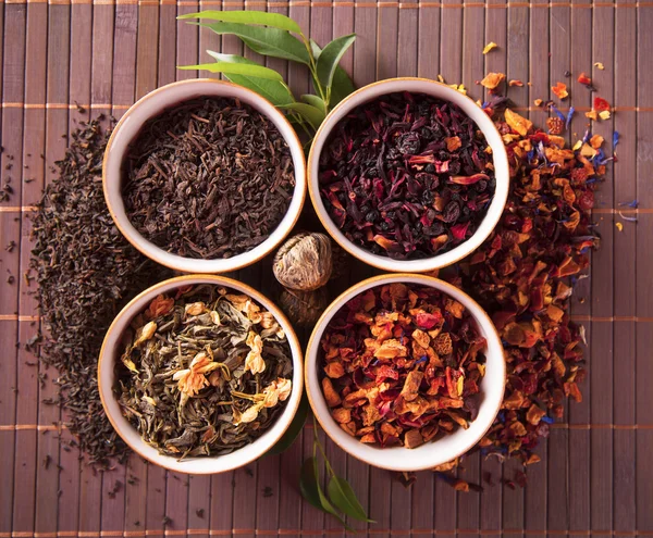 Various dry tea in small bowls — Stock Photo, Image