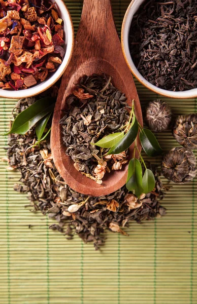 Various dry tea in small bowls — Stock Photo, Image