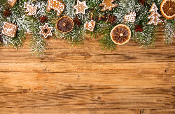 Gingerbread on fir tree braches — Stock Photo, Image